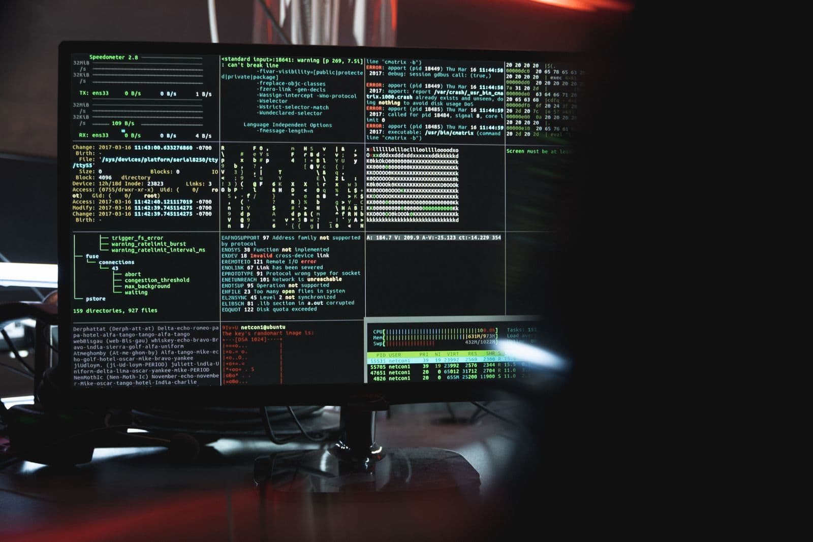 Close-up of a screen showing system monitoring, including network traffic in bytes per second